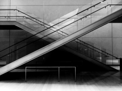 grayscale photo of glass stairs