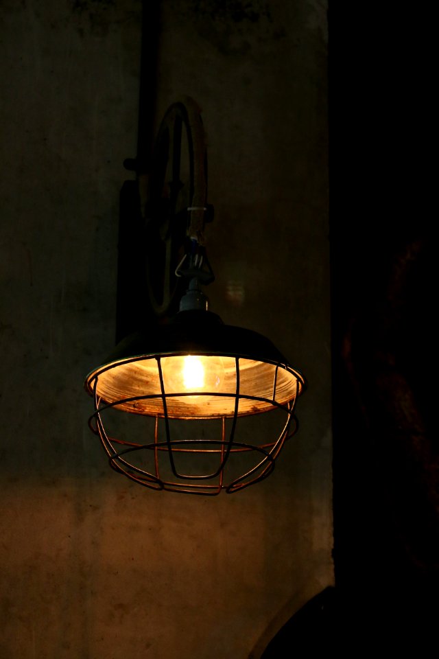 brown sconce with lights on