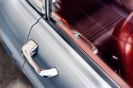 selective focus photo of gray vehicle door handle photo