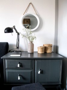 black desk lamp on black wooden drawer photo