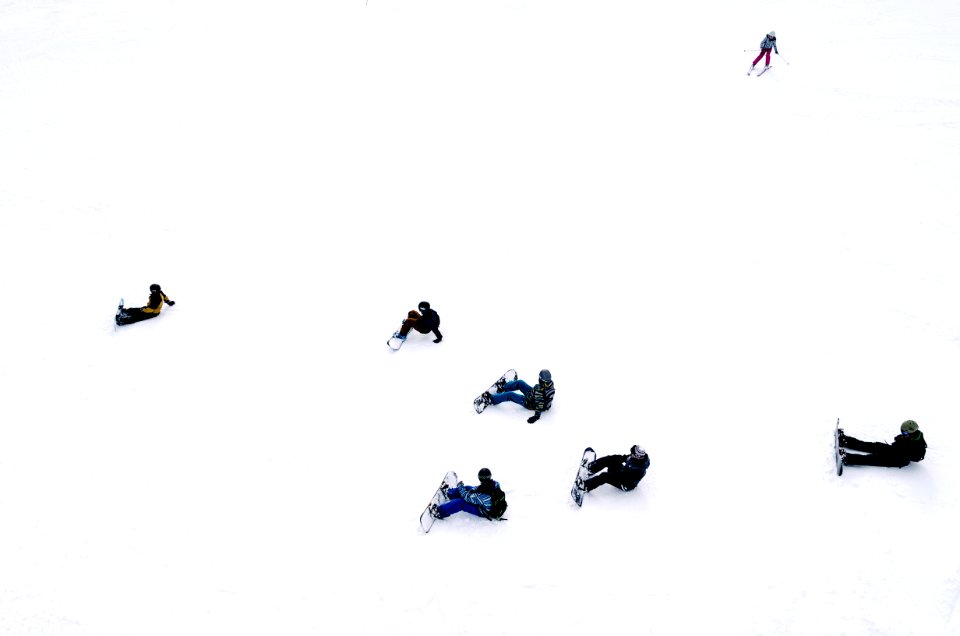 people playing snowboards