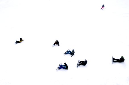 people playing snowboards