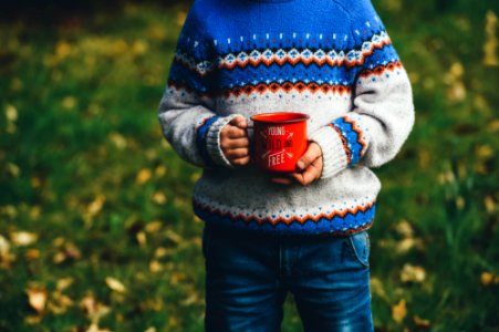 person holding ceramic mug