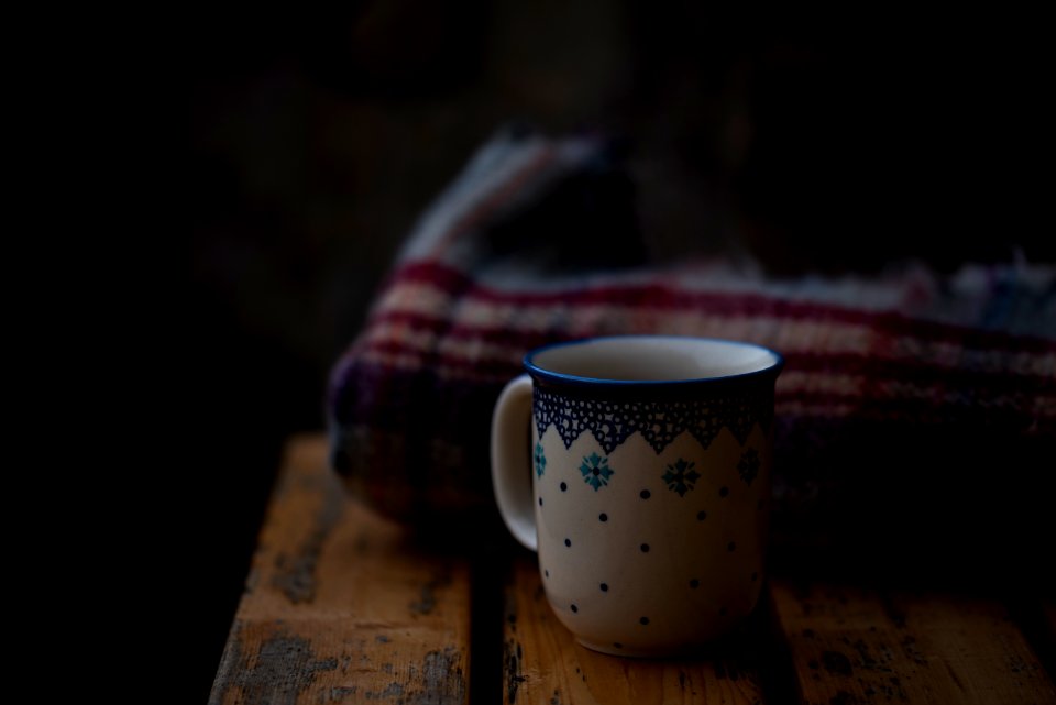 white and blue coffee mug