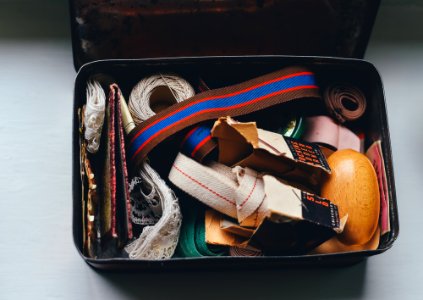 assorted belts and packs on metal case photo