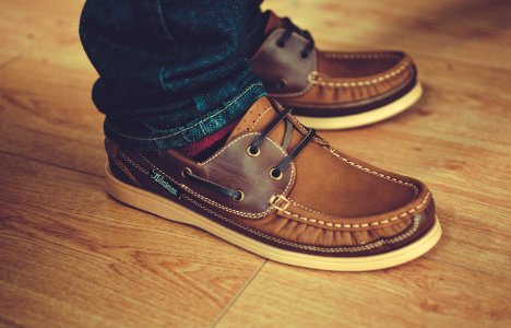 person wearing pair of brown leather shoes photo