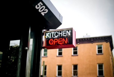 white and red neon lighted kitchen open signage during daytime photo