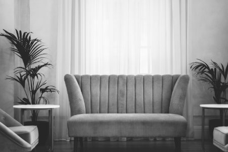 grey couch near white window curtain during daytime photo