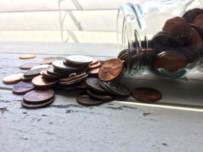 A mason jar full of pennies. photo