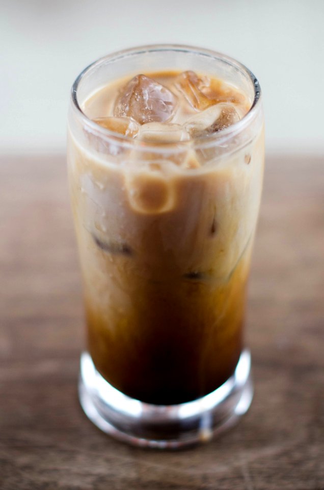 clear drinking glass with brown liquid