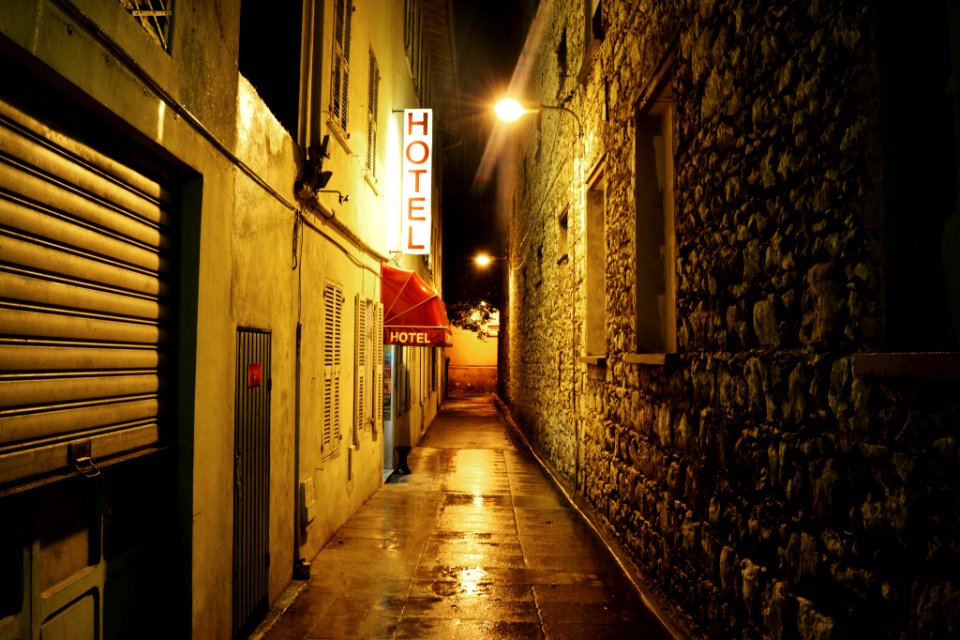 narrow road between buildings photo