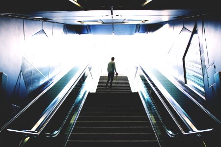 man standing on escalator photo