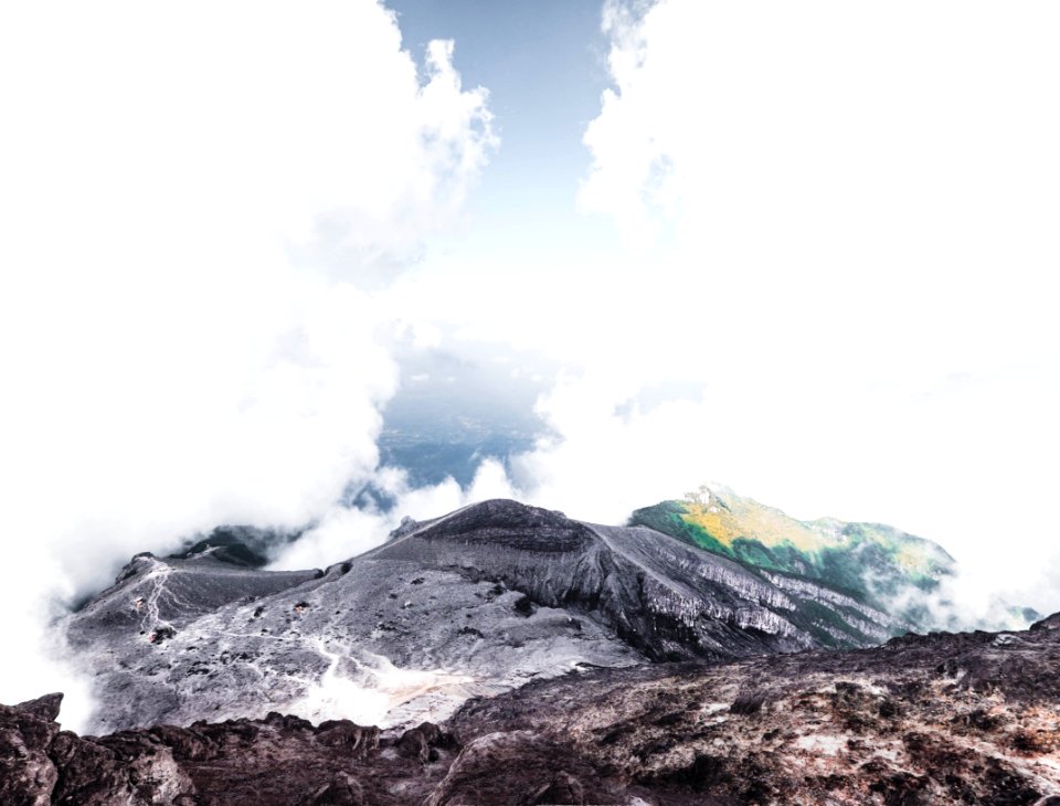 landscape photography of mountain surrounded by clouds