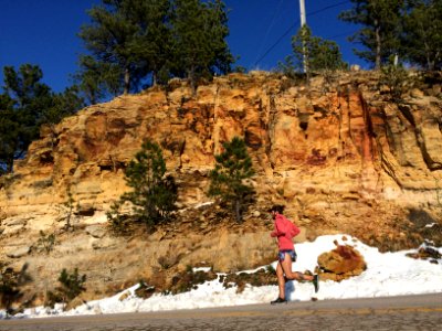 person jogging beside clif photo