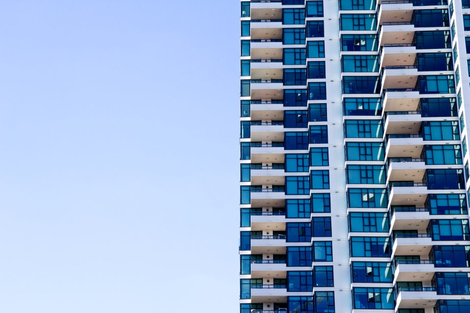 blue and grey high-rise glass building