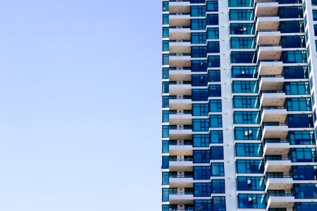 blue and grey high-rise glass building photo