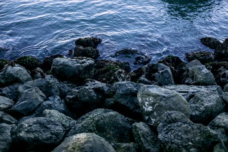 gray rocks on body of water during daytime photo