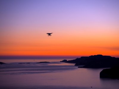 silhouette photo of drone on seashore