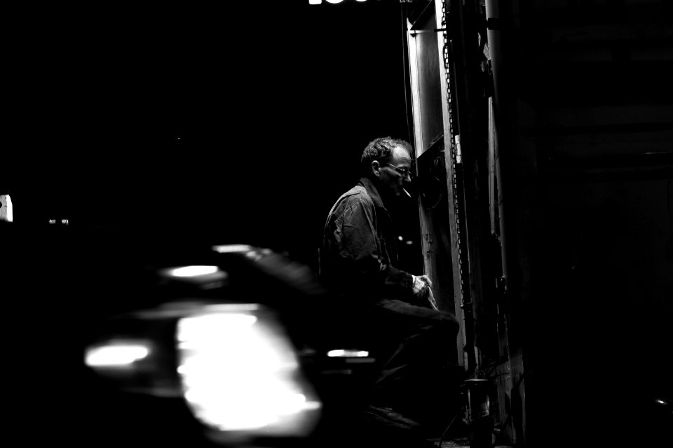 man sitting down near mirror