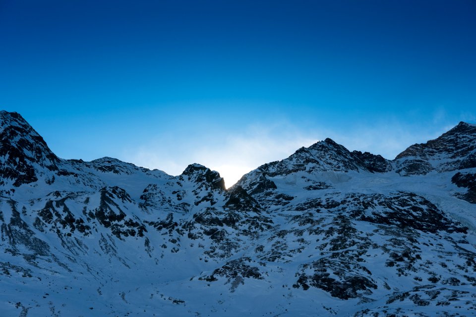 snow covered mountain under blue sky at daytime