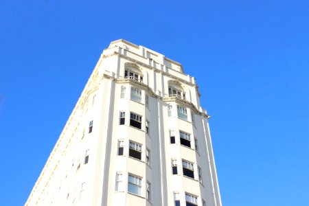 low-angle photography of white concrete high-rise building