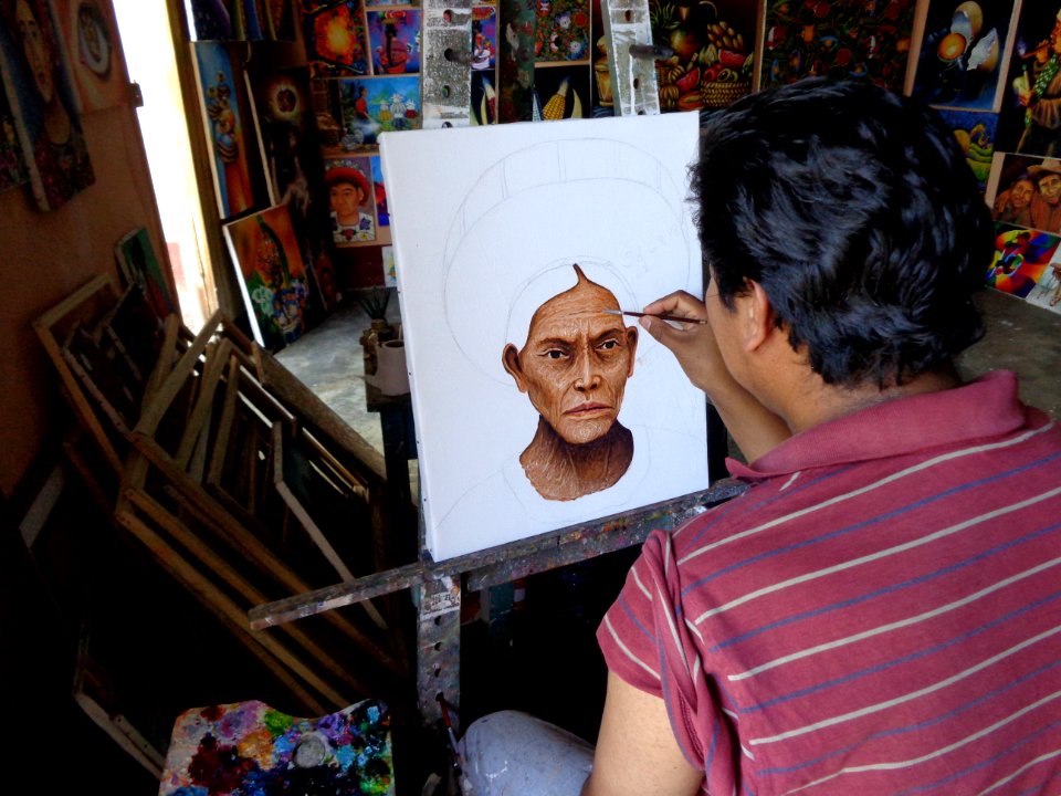 A man making a portrait of another person.