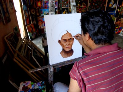 A man making a portrait of another person.