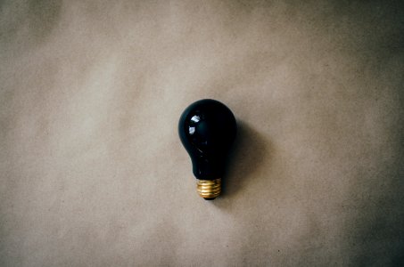 black light bulb on gray surface photo