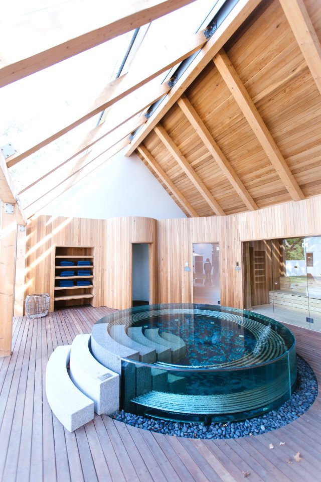 A beautiful indoor spa tub fit for six people.
