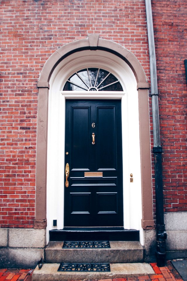 black wooden door in a building close-up photography
