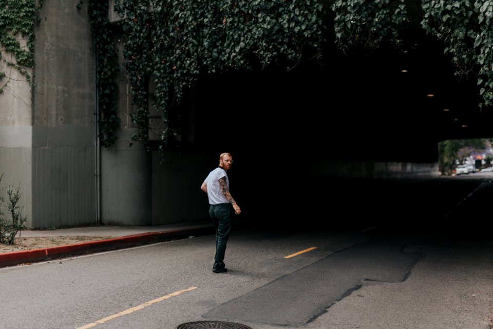 man walking through the tunnel