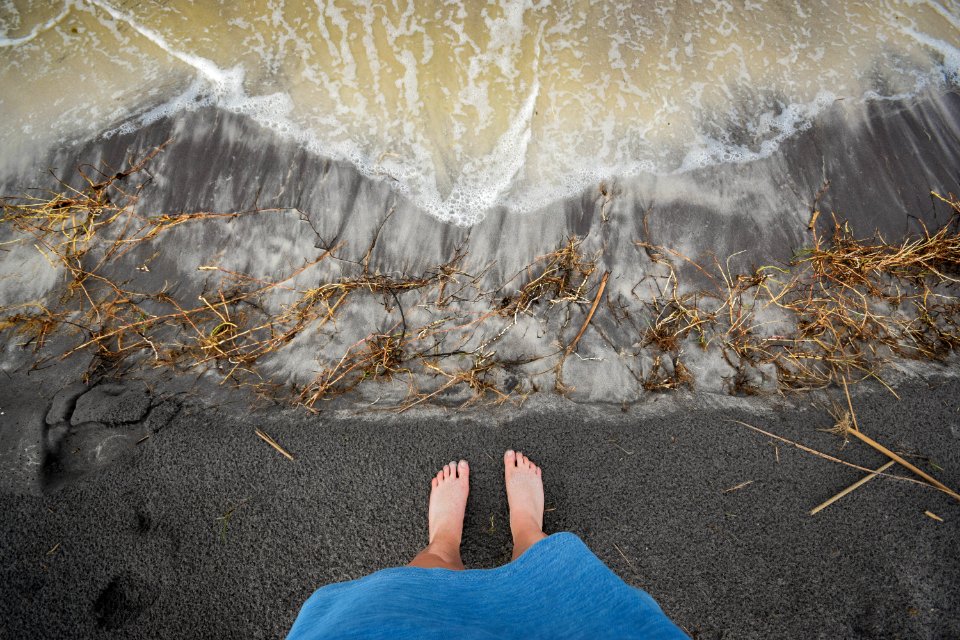 person standing on seashore