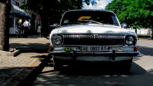 white car on road photo