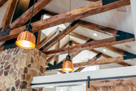 two brown pendant lamps turned on in room photo