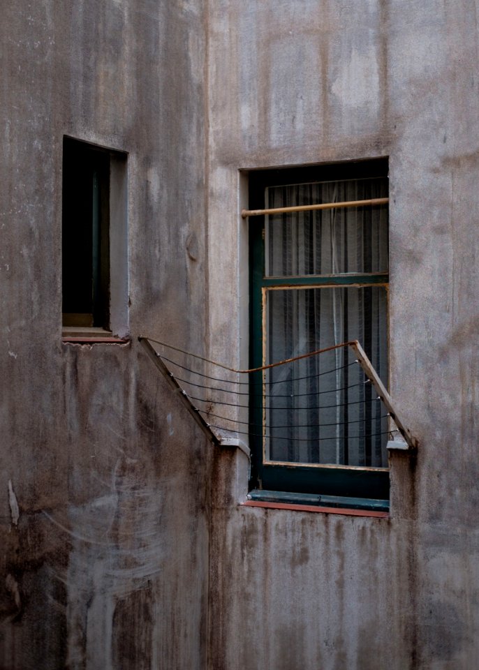 brown steel frames beside glass window