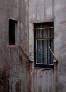 brown steel frames beside glass window