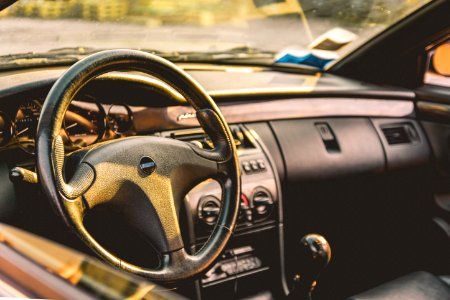 shallow focus photography of car steering wheel photo