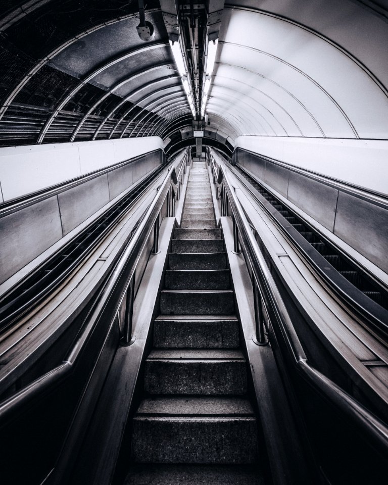grayscale photo of escalator photo