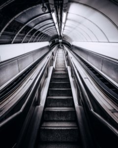 grayscale photo of escalator photo