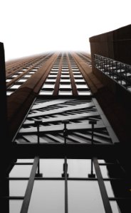 brown and clear curtain wall building close-up photography photo