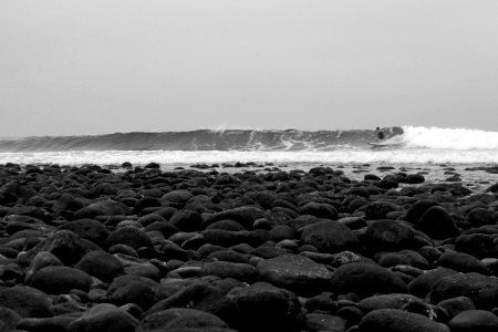 gray stones near the ocean waves photo