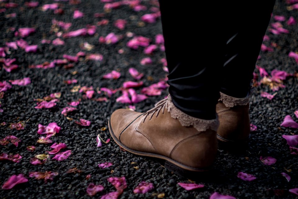 person wearing brown leather shoes