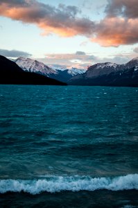 mountains near body of water under white clouds photo