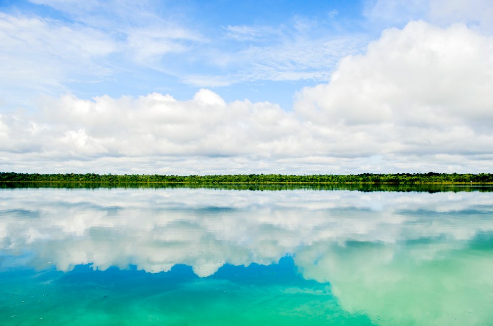 reflection of clouds in body of water