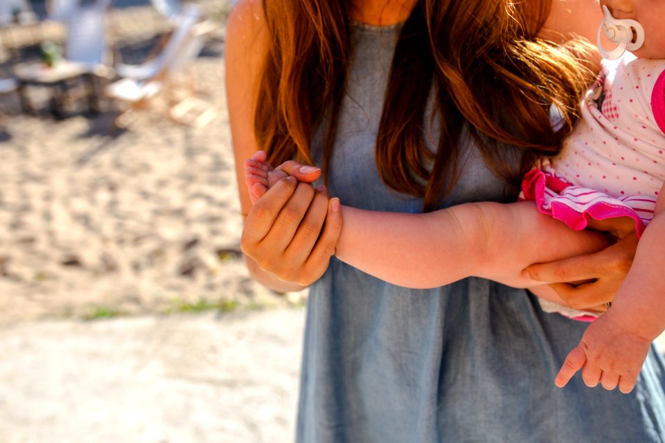 A woman holding her baby.