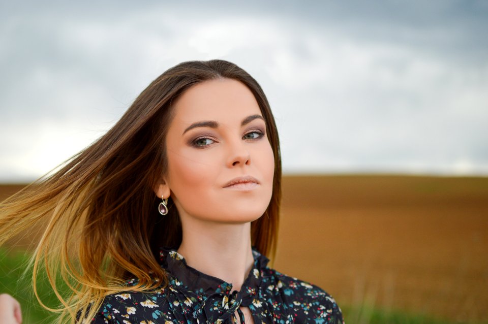 woman wearing floral top at the field during day