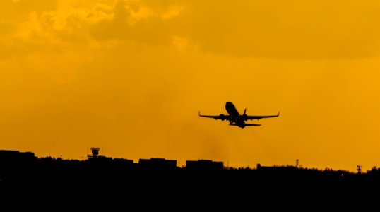 silhouette photo of flying airplane