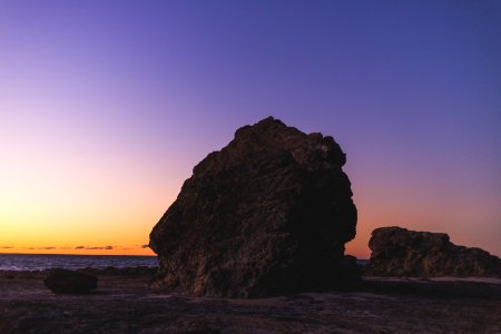 brown rock near sea shore photo