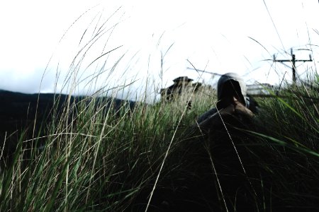 man in hoodie near grass