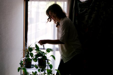 woman standing beside plants photo